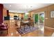 This kitchen features wood cabinets, stainless appliances, and a sliding door to the backyard at 15962 W 70Th Dr, Arvada, CO 80007