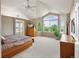 Spacious main bedroom with vaulted ceilings and a large window with scenic views at 15962 W 70Th Dr, Arvada, CO 80007