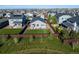 Expansive aerial view showcasing a well-manicured backyard and tasteful home nestled in a friendly neighborhood at 14431 Forest St, Thornton, CO 80602