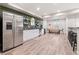 The basement boasts a kitchen area, dining space, bar and abundant room for entertaining at 14431 Forest St, Thornton, CO 80602