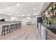 The basement includes wet bar, kitchenette, seating and recreation area, providing lots of space at 14431 Forest St, Thornton, CO 80602
