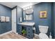Stylish bathroom features a modern vanity with generous drawers and a mirror reflecting the bright interior at 14431 Forest St, Thornton, CO 80602