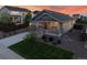 Charming home featuring landscaped front yard, inviting porch and an attached two-car garage at 14431 Forest St, Thornton, CO 80602