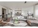 Bright open-concept living room featuring a comfortable couch and modern decor at 14431 Forest St, Thornton, CO 80602