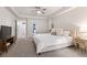 Spacious main bedroom features a seating area and a view of the ensuite at 14431 Forest St, Thornton, CO 80602