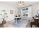 Bright home office with neutral rug, white desk, and a piano at 14431 Forest St, Thornton, CO 80602