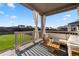 Inviting covered patio with comfortable seating, offering a relaxing outdoor space overlooking a well-manicured yard at 14431 Forest St, Thornton, CO 80602