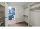 Bright walk-in closet provides ample storage solutions and convenient access to an adjacent modern bathroom at 14431 Forest St, Thornton, CO 80602