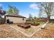 Spacious backyard featuring raised garden beds and a well-maintained lawn at 3000 N Fillmore St, Denver, CO 80205