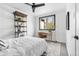 Bright bedroom with a ceiling fan, neutral walls, and a cozy rug under the bed at 3000 N Fillmore St, Denver, CO 80205
