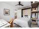 A comfortable bedroom featuring a bed with a unique headboard and stylish decor at 3000 N Fillmore St, Denver, CO 80205