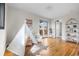 Spacious bonus room with hardwood floors, built-in shelving, and outdoor access at 3000 N Fillmore St, Denver, CO 80205