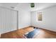 Bright exercise room with wood floors, workout mat, and ample space for fitness activities at 3000 N Fillmore St, Denver, CO 80205