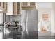 Sleek stainless steel refrigerator in a bright kitchen, next to a stylish backsplash at 3000 N Fillmore St, Denver, CO 80205