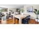 A stylish living and dining area with hardwood floors, neutral colors, and modern decor at 3000 N Fillmore St, Denver, CO 80205