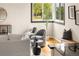 Cozy seating area with soft chairs, a view through a window, and modern decor at 3000 N Fillmore St, Denver, CO 80205