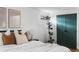 Charming bedroom with modern decor and a house plant, offering a comfortable and inviting atmosphere at 3000 N Fillmore St, Denver, CO 80205