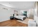 Bedroom with modern decor, wood floors, and a decorative rug, creating a cozy and inviting space at 3000 N Fillmore St, Denver, CO 80205