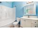 Bathroom with a shower-tub combination, vanity with cabinets, and light-blue painted walls at 18038 Becket Dr, Parker, CO 80134