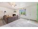 Bright living room features a cozy fireplace and large window with natural light at 18038 Becket Dr, Parker, CO 80134