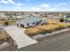 Well maintained residence with mature landscaping, large driveway, and fenced backyard at 11177 E 162Nd Pl, Brighton, CO 80602