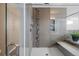 Beautiful bathroom with a glass shower and decorative tiled wall at 11177 E 162Nd Pl, Brighton, CO 80602