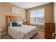 Bedroom featuring a window, neutral walls, and cozy decor at 11177 E 162Nd Pl, Brighton, CO 80602