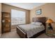 Cozy bedroom with a window view, neutral walls, and carpeted floors at 11177 E 162Nd Pl, Brighton, CO 80602