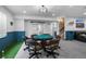 Finished basement offers a game room with poker table and mini golf at 11177 E 162Nd Pl, Brighton, CO 80602