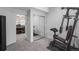 Basement gym with exercise equipment and mirrored closet at 11177 E 162Nd Pl, Brighton, CO 80602