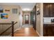 Hallway with hardwood floors and barn door that leads to other rooms in the house at 11177 E 162Nd Pl, Brighton, CO 80602