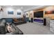 Cozy living room with fireplace and a large flatscreen TV at 11177 E 162Nd Pl, Brighton, CO 80602