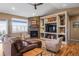 Cozy living room featuring a fireplace, vaulted ceilings and comfortable furniture at 11177 E 162Nd Pl, Brighton, CO 80602