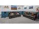 Spacious and modern living room area with cozy leather sofas at 11177 E 162Nd Pl, Brighton, CO 80602