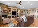 Inviting living room with a fireplace, built-in shelving, and comfortable seating at 11177 E 162Nd Pl, Brighton, CO 80602