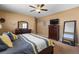 Comfortable main bedroom featuring neutral walls and a ceiling fan at 11177 E 162Nd Pl, Brighton, CO 80602