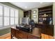 Cozy home office with custom built-ins, plantation shutters, and ample natural light at 11177 E 162Nd Pl, Brighton, CO 80602