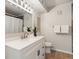 Bright bathroom featuring a white vanity with a quartz countertop and a modern vessel sink at 11195 Alcott St # D, Westminster, CO 80234