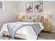 Tastefully decorated bedroom with soft bedding, matching lamps, and stylish artwork at 11195 Alcott St # D, Westminster, CO 80234