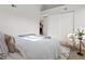 Serene bedroom offering ample closet space, comfortable seating, and a view into the kitchen at 11195 Alcott St # D, Westminster, CO 80234
