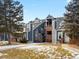 Charming multi-story home featuring a brick chimney and frosted yard at 11195 Alcott St # D, Westminster, CO 80234