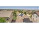 Suburban neighborhood featuring a home with solar panels and mountain views in the distance at 7845 S Flat Rock Way, Aurora, CO 80016
