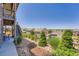 Landscaped backyard with stairs and small trees at 7845 S Flat Rock Way, Aurora, CO 80016