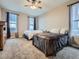 Bright bedroom with two beds and carpeted floor; windows offer scenic views at 7845 S Flat Rock Way, Aurora, CO 80016