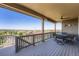 Covered deck with table and chairs overlooking the neighborhood at 7845 S Flat Rock Way, Aurora, CO 80016