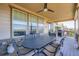 Covered deck with ample seating and lovely neighborhood views at 7845 S Flat Rock Way, Aurora, CO 80016