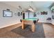 Game room with a pool table, decorated walls, and a view of an open doorway at 7845 S Flat Rock Way, Aurora, CO 80016