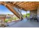 Covered patio with outdoor seating and scenic neighborhood views at 7845 S Flat Rock Way, Aurora, CO 80016