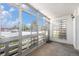 Enclosed balcony with large windows offering natural light and outdoor views at 350 S Clinton St # 2A, Denver, CO 80247