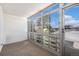 Bright enclosed balcony featuring large windows offering expansive outdoor views, enhancing the indoor-outdoor living experience at 350 S Clinton St # 2A, Denver, CO 80247